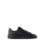 Svarte Skinn Court Sneakers