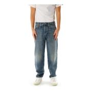 Avslappet Tapered Fit Mid Waist Jeans